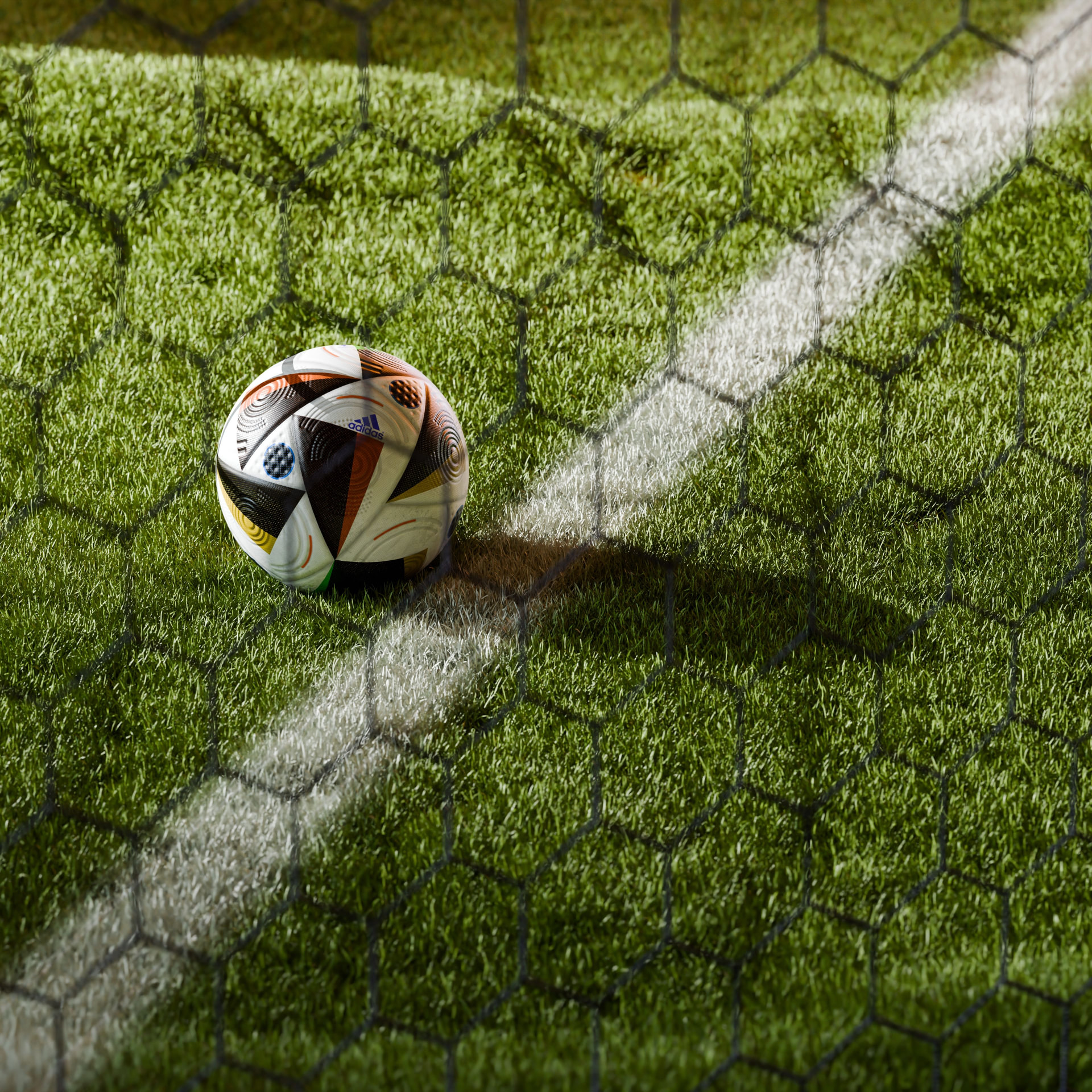 Young soccer player kicking a ball on a green field